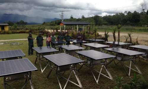 Villagers look at Solar Panels